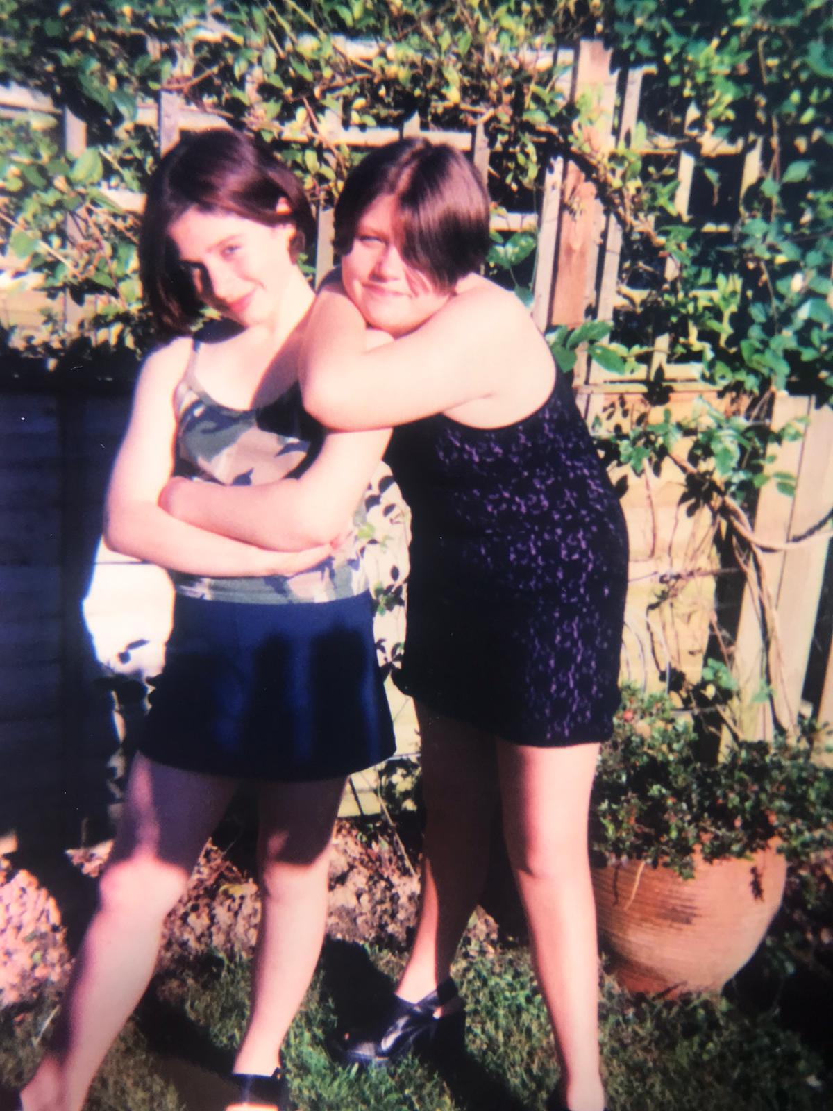 Two friends embracing outdoors - authentic friendship and nervous system regulation